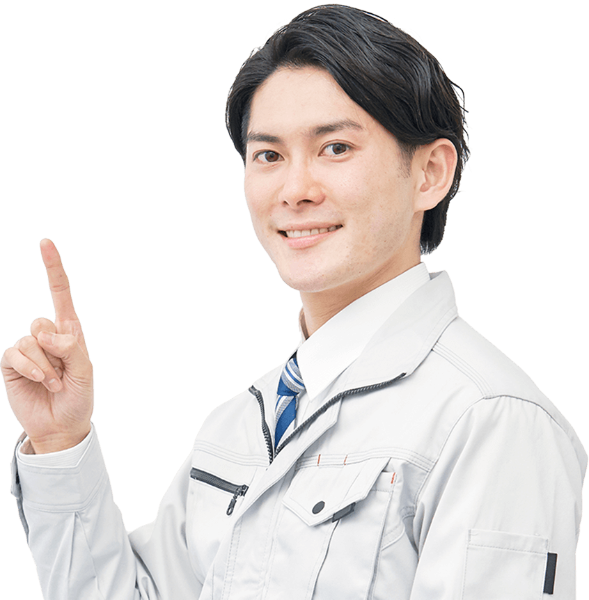 作業着を着た男性が人差し指を立ててポイントを示しているポーズ